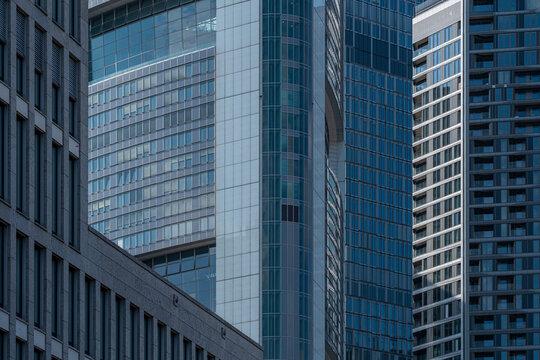 Modern business tower with reflective surfaces in financial center, symbolizing economic growth, corporate design, international finance and urban development