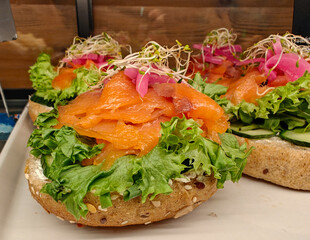 A typical Norwegian sandwich with smoked salmon, lettuce and sprouted wheat.
