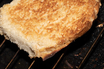 Close up of toasted burger bun being grilled