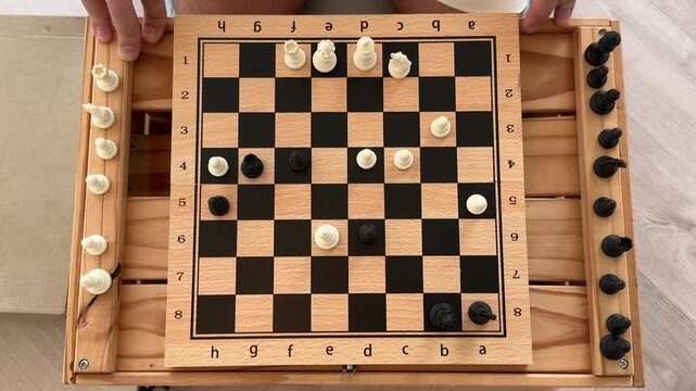 Engaging in Strategic Chess Moves on the Checkerboard Layout During Exciting Match