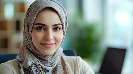 A professional wearing a headscarf participating in a virtual team meeting, contributing ideas and leading the discussion.