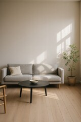 Cozy minimalist living room with gray sofa, black round coffee table, and indoor potted plant.