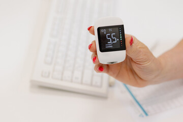 Monitoring vital signs with a portable device in a modern workspace