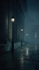 Dark, moody scene of illuminated lamps along a colonnade under a foggy night. Wet pavement reflects the light. Architecture is imposing