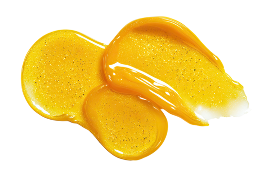 Two swaths of golden-yellow, glossy, cosmetic product.  Small gold flecks are visible within the substance.  Image is isolated on a black background