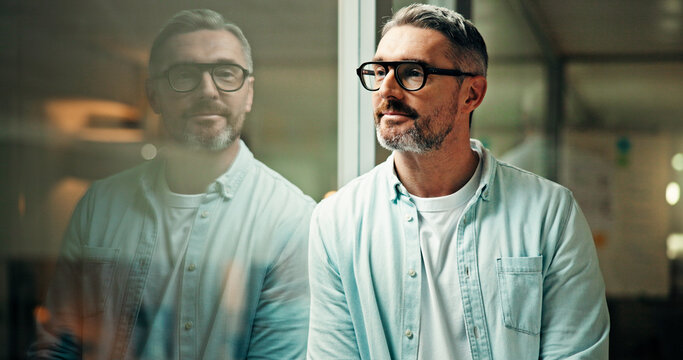 Thinking, glass and business man in office for inspiration, reflection and thoughtful for decision in dark. Professional, project manager and mature person with ideas, planning and solution at night