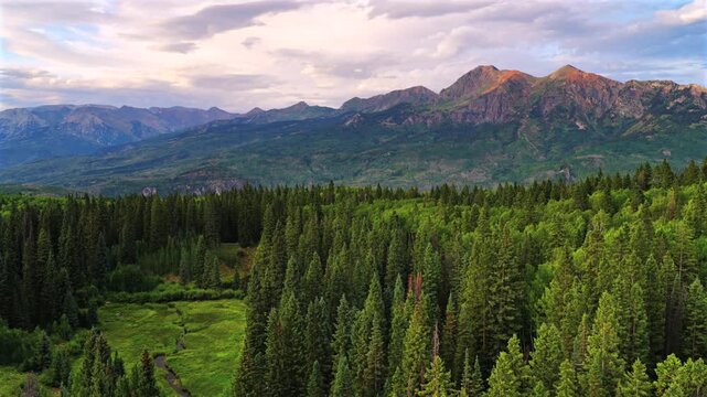 Kebler Pass Lost Lake camp ground summer sunset Crested Butte Paonia aerial drone Colorado Ruby Peak Sawatch Range Rocky Mountains landscape Irwin Lake Ohio Pass Aspen Trees Forest blue sky backwards