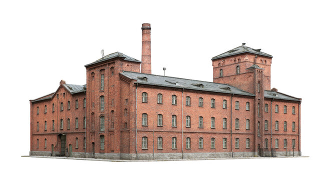 Vintage red brick industrial factory building with tall chimney and towers