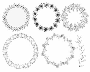 Collection of hand drawn floral and leafy wreaths and decorative elements