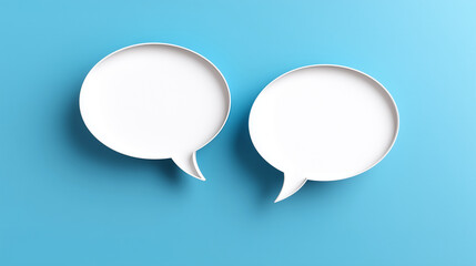 Fototapeta premium Two white speech bubbles on a blue background, communication bubbles, blue design, conversation theme, modern messaging, simple dialogue