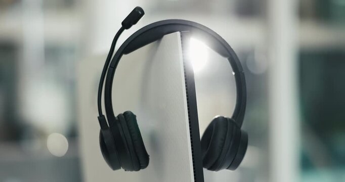Empty, office and headset on computer in call center for lead generation, online sales and crm. Business, equipment and mic on pc for customer service, virtual assistance and support in workplace