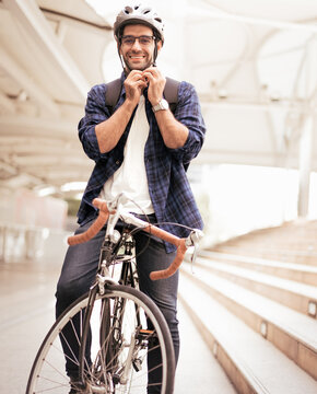 Smart businessman ride bicycle in downtown. Environmentalist commuting by cycling reduce carbon footprint global warming. Bike to work eco friendly alternative transportation green energy vehicle