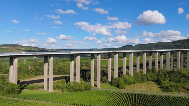Moselle Viaduct Longuich, vineyard in Mosel valley, bridge of highway crossing river near Trier, german autobahn, aerial view
