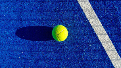 Sport Padel Tennis A Vibrant Yellow Ball on a Blue Court