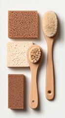 Stylish Natural Cleaning Brushes and Sponges on Minimalist Background for Eco-Friendly Lifestyle

