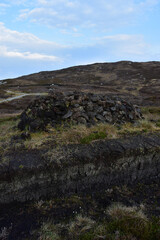 Stack of Drying Peat Bricks in a Pile
