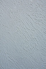 Crumbling cement white whiten tone paint on shabby wall texture. Abstract texture concrete plaster white whiten wall