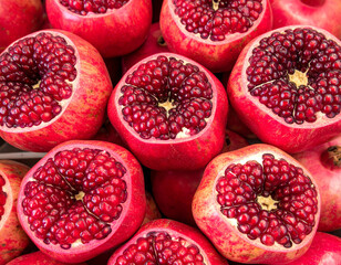 A close-up of ripe pomegranates, a fruit often associated with Israel, showcasing their vibrant color and seeds.