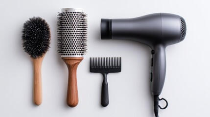 A collection of hair styling tools including brushes and a hair dryer arranged neatly on a light background.