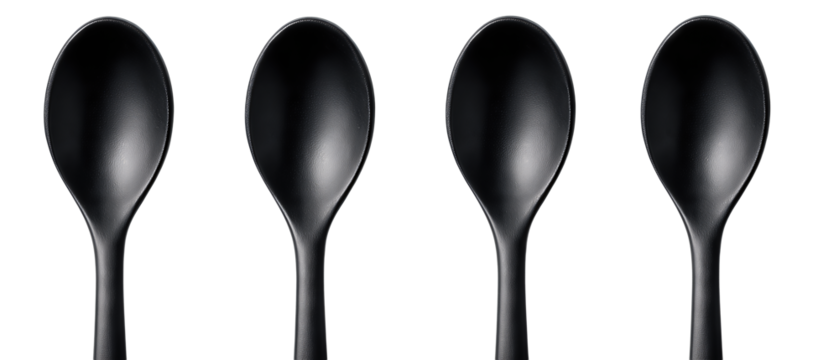 Four matching matte black tasting spoons arranged upright in uniform spacing, isolated on transparent background.
