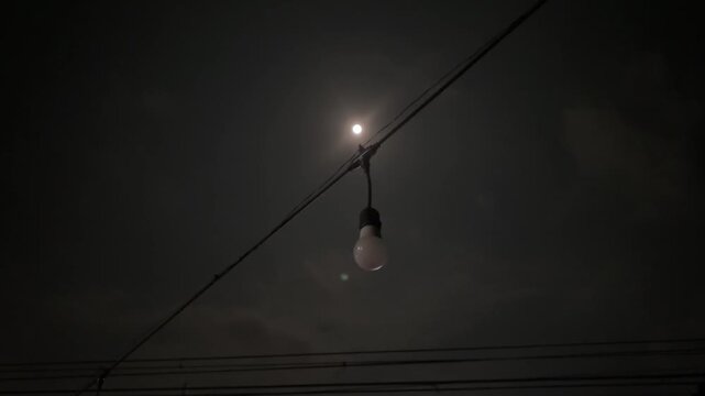 white bulb against shining moonlight