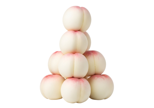A visually appealing arrangement of white peaches, stacked in a triangular pattern against a black background, showcasing their smooth, rounded forms and delicate pink blush.