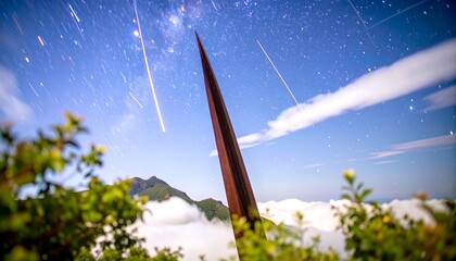 Night sky, spire, mountain clouds
