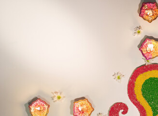 Elegant Diwali candle display with floral decorations and vibrant colors