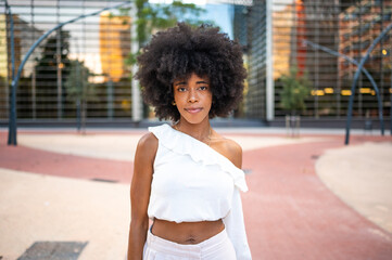 Young black woman posing in a modern urban space