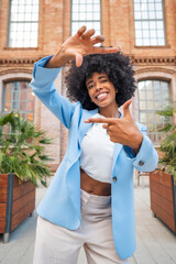 Confident Woman Framing with Hands Outdoors