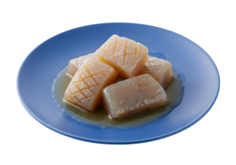Steamed konjac slices, arranged attractively on a vibrant blue plate, glistening with sauce.