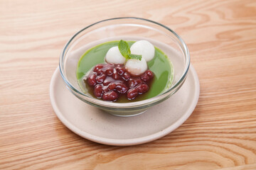 Close up Japanese red bean matcha balls at a wood table