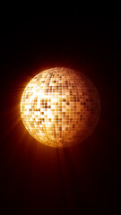 Glowing golden disco ball made of digital squares radiating bright light in a dark environment