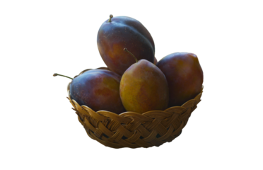 Large plums placed in a basket on a white background