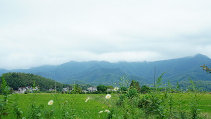 Obraz premium The beautiful mountains landscapes with the green forest and little village as background in the countryside of the China 