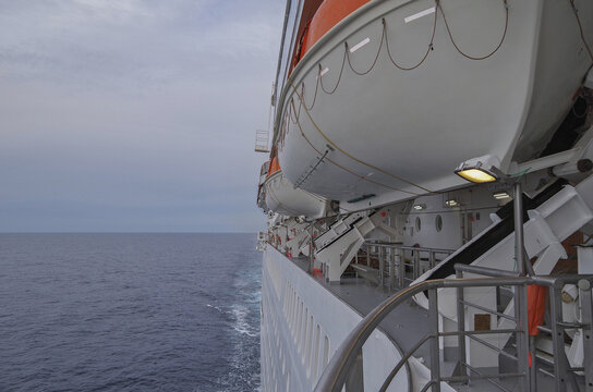 Fototapeta Scenic panoramic seascape view of Ocean and clouds and blue hour twilight sky seen from outdoor deck of luxury cruiseship cruise ship liner