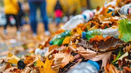 Plastic bottles and litter polluting vibrant autumn leaves on the ground, illustrating environmental waste and human impact