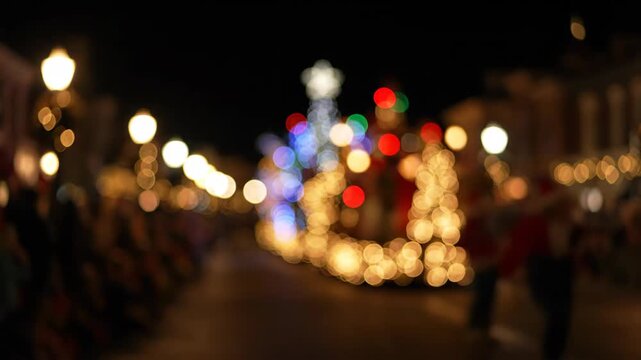 Blurry Christmas Parade on Main Street Usa at Night in Magic Kingdom Shows Many Lights and Festive Spirit
