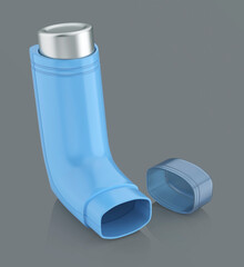 Blue portable asthma inhaler on shiny grey background