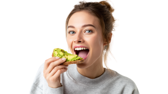 Woman enjoying a healthy avocado toast with a joyful expression, isolated on white background.