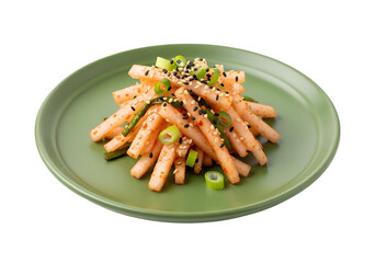 A vibrant display of thinly sliced radish kimchi, garnished with sesame seeds and green onions, presented on a sage-green plate.