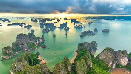 Aerial view floating fishing village and rock island, Halong Bay, Vietnam, Southeast Asia. UNESCO World Heritage Site. Junk boat cruise to Ha Long Bay. Popular landmark, famous destination of Vietnam © huythoai