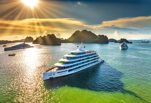 Aerial view of landscape Halong Bay, Vietnam view from adove. Tourist cruise ship floating among limestone rocks. This is the UNESCO World Heritage Site, it is a beautiful natural wonder in northern V