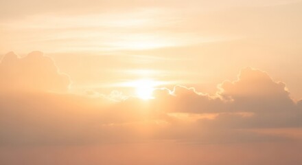 Fototapeta premium Warm Golden Sunset with Soft Clouds and Bright Light Bursting Through the Sky, Natural Atmosphere