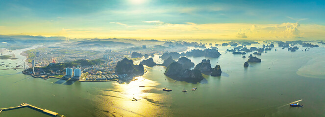 Aerial view floating fishing village and rock island, Halong Bay, Vietnam, Southeast Asia. UNESCO World Heritage Site. Junk boat cruise to Ha Long Bay. Popular landmark, famous destination of Vietnam © huythoai