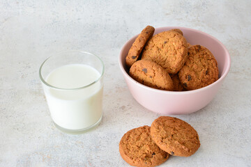 healthy oatmeal Cookies in pink bowl and Milk A Simple Delight