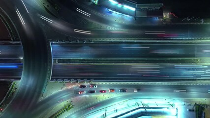 Hyperlapse time-lapse of car traffic transportation above circle roundabout road in Asian city. Drone aerial view fly in expressway circle, high angle. Public transport or commuter city life concept - Powered by Adobe