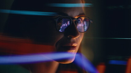 Night woman charts reflection wearing eyeglasses looking computer screen closeup