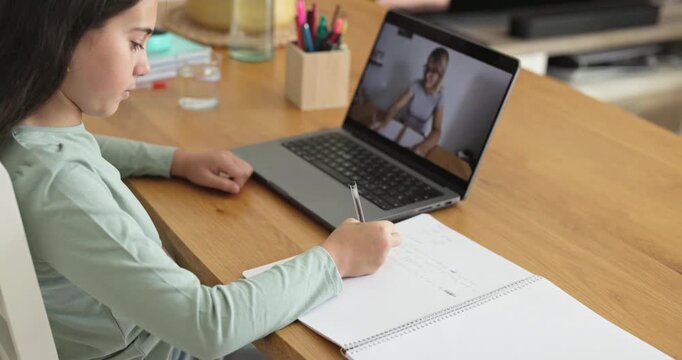 Teenager girl doing private school class using laptop at home - Education, back to school and lifestyle concept