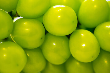 Shine Muscat grapes on a white background. White grapes.
